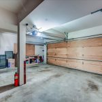 Oversized 2-car garage includes room for storage and workshop